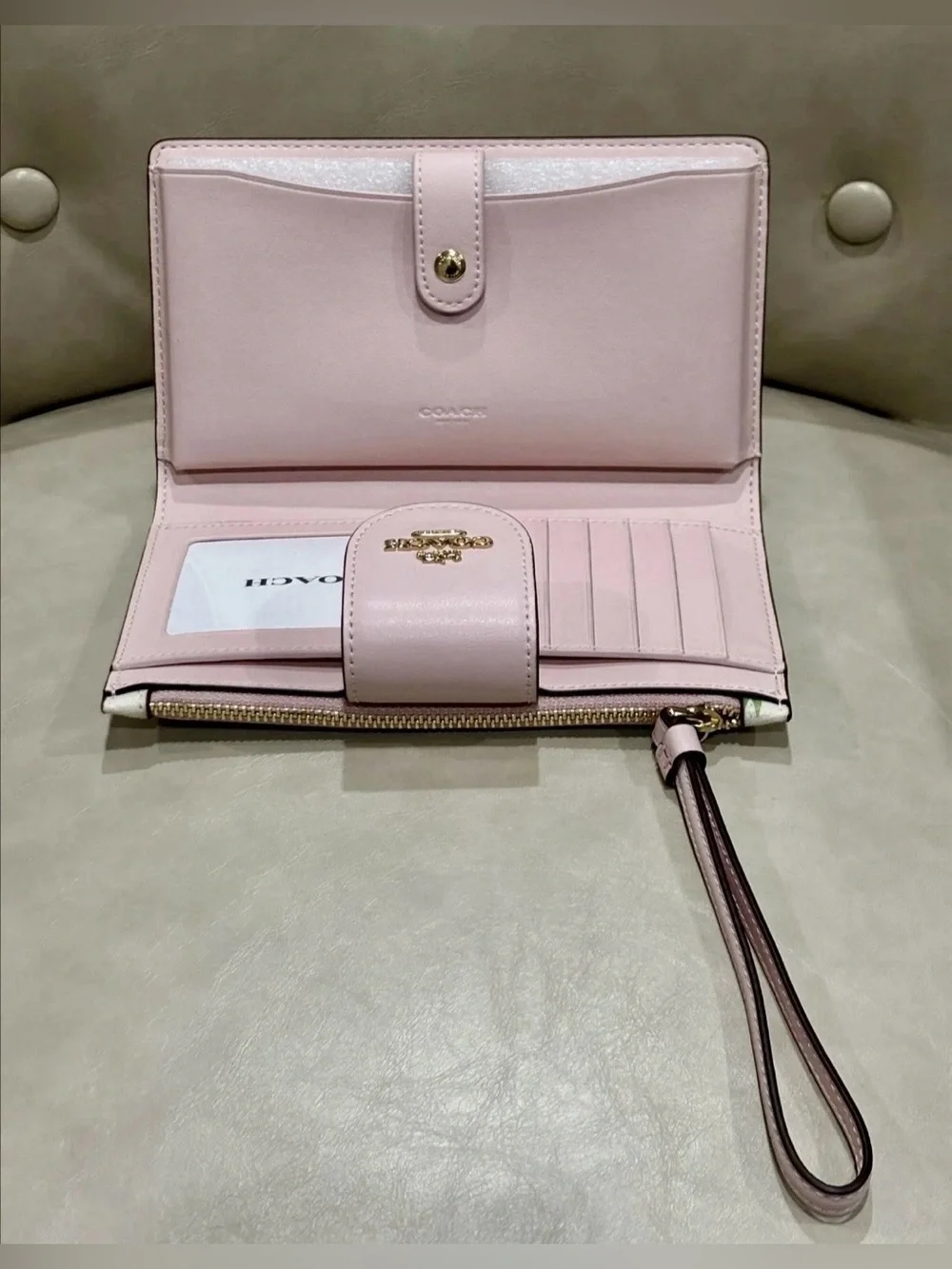 Coach white Leather Multi Color Flower Print phone Wristlet Wallet.